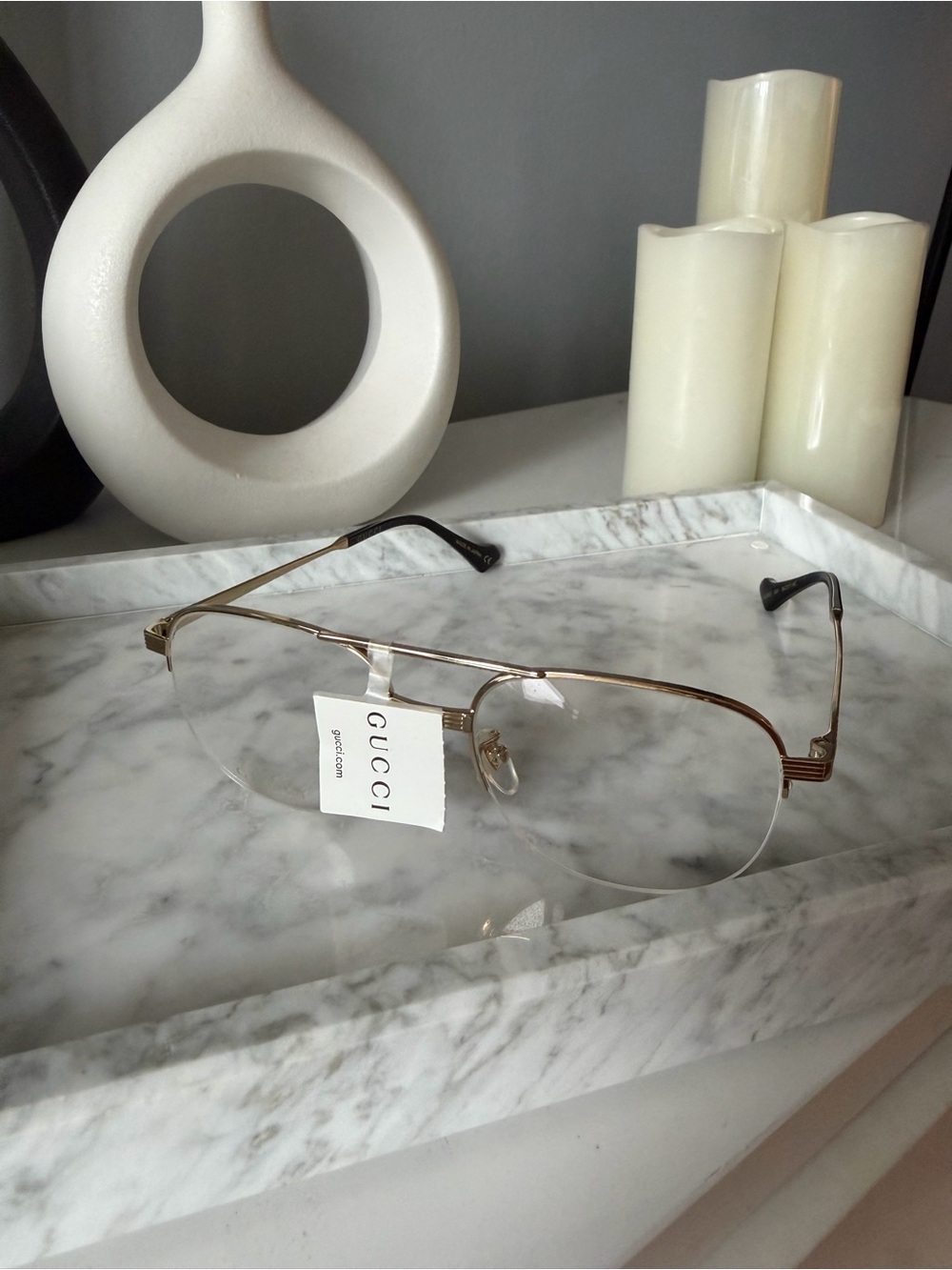Gucci Gold Rimless Eyewear with Black Temple Tips